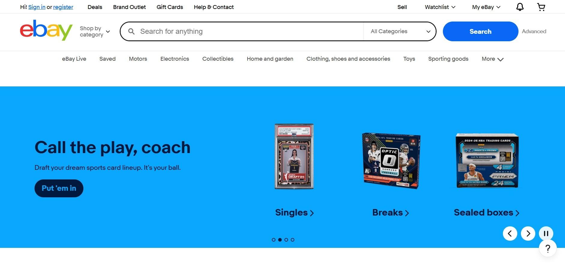 eBay homepage with a sports trading cards banner and category links